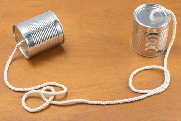 istock Cans joined by cord as a telephone 1287412870