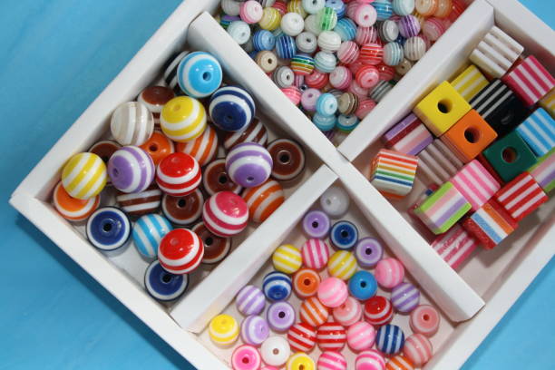 istock Beads in a box of different colors. 1287413117