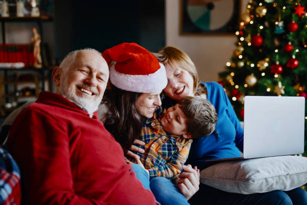 istock Happy multi-generation family portrait on Christmas day 1287413491