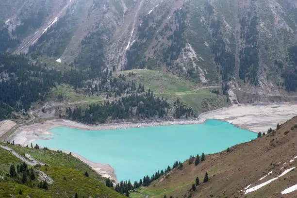 Photo of Beautiful landscape of blue lake in the mountains. Big Almaty Lake in the spring.