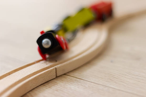 Wooden toy train derailing Wooden toy train derailing derail stock pictures, royalty-free photos & images