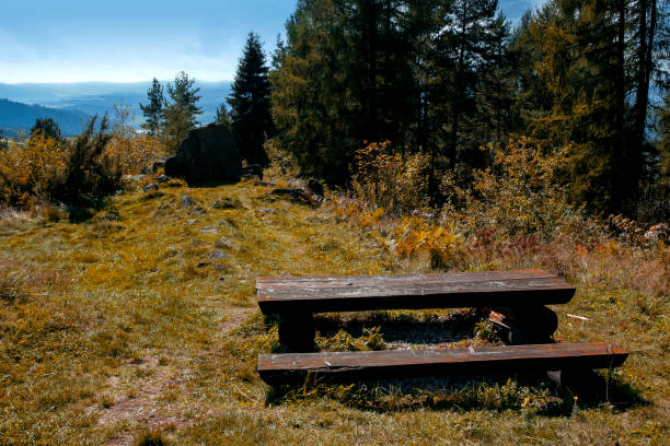 rustic picnic table and benches on the top of the Wdar Mountain in Kluszkowce, Pieniny, Poland