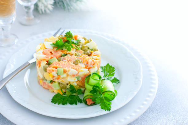 istock New Years festive salad with red fish on a white plate, horizontal, place for text 1287416453