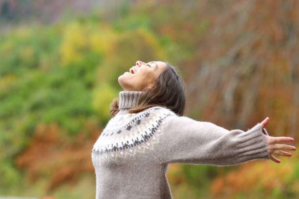 istock Middle age excited woman celebrating in the mountain 1287418949