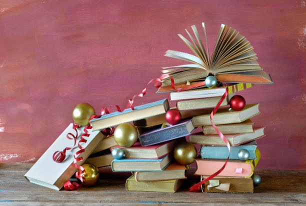 istock books as christmas gift,christmas present,reading,literature,education,making a gift concept 1287419170