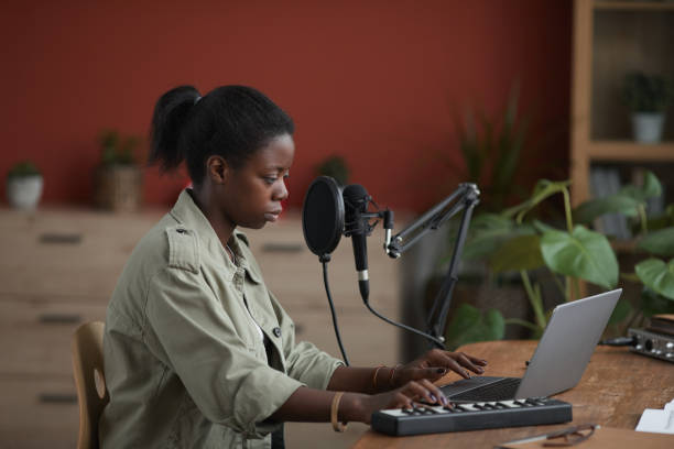 istock Side View at Female African-American Musician 1287419212
