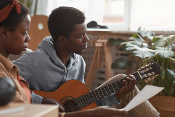 istock Creative African-American Couple Writing Music 1287419307