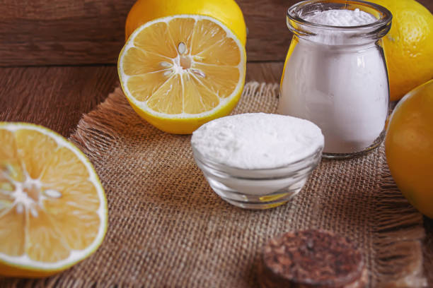 istock Citric acid on a wooden background with lemon. Selective focus. 1287421621