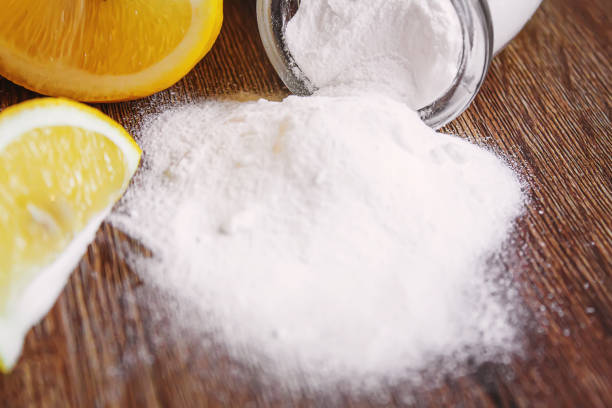 istock Citric acid on a wooden background with lemon. Selective focus. 1287421629