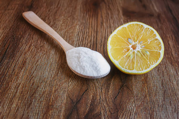 istock Citric acid on a wooden background with lemon. Selective focus. 1287421644
