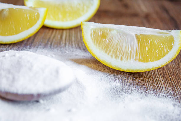 istock Citric acid on a wooden background with lemon. Selective focus. 1287421649