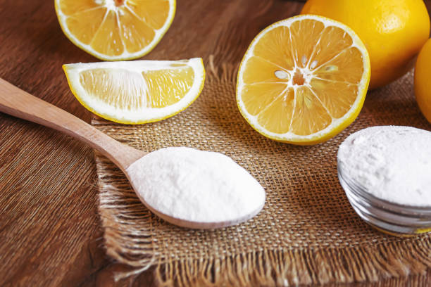 istock Citric acid on a wooden background with lemon. Selective focus. 1287421653