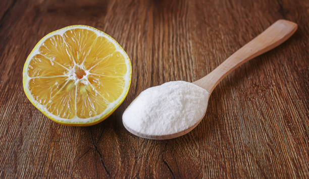 istock Citric acid on a wooden background with lemon. Selective focus. 1287421656