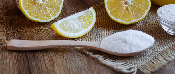 istock Citric acid on a wooden background with lemon. Selective focus. 1287421664