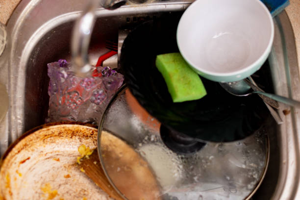 istock Dirty dishes in the kitchen sink. 1287423432
