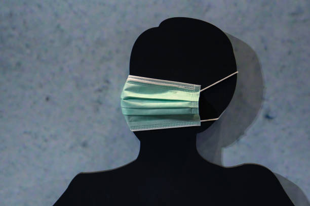 istock COVID 19 protective mask is worn on a black mannequin. 1287424368