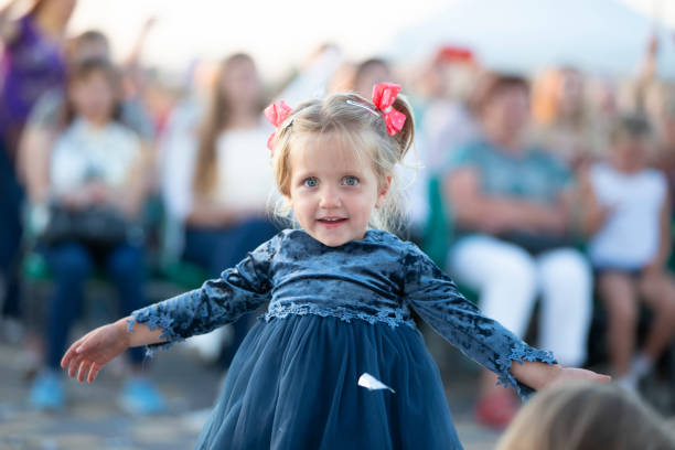 istock Funny little girl on a holiday. 1287424583