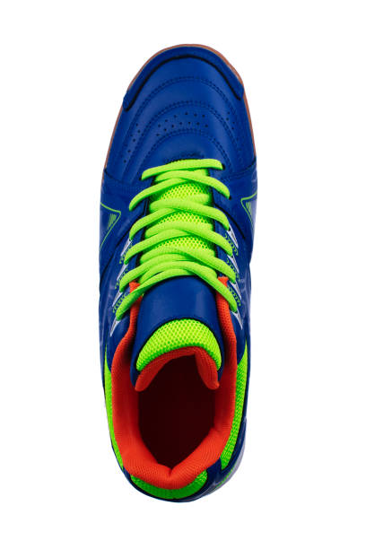 istock Blue sneakers with green laces and stripes. 1287425823