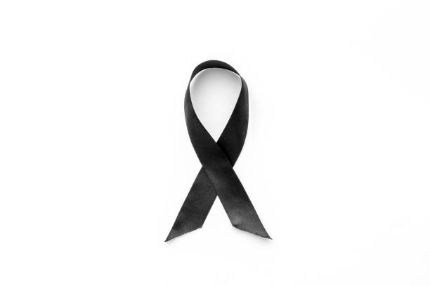 istock Black awareness ribbon isolated on a white background. Top view 1287426199