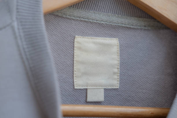 istock Clothing label on light gray sweater mockup 1287428689