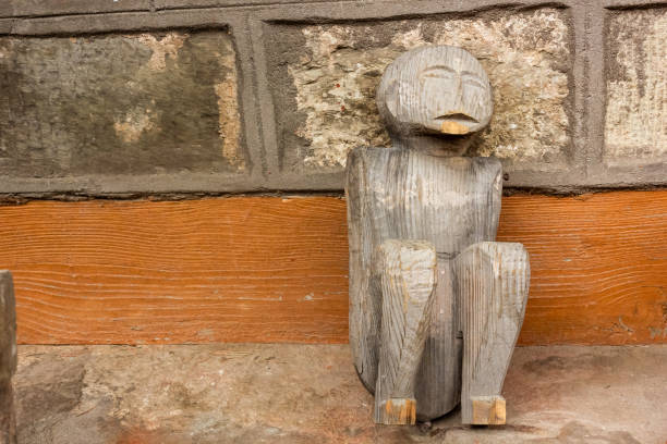 Naggar, Himachal Pradesh, India - June 2012:  An old, unfinished wooden figure in an ancient Hindu temple in the Kullu valley.