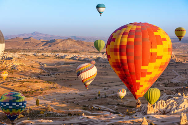 istock Hot air balloon flying over Cappadocia, Turkey 1287428804