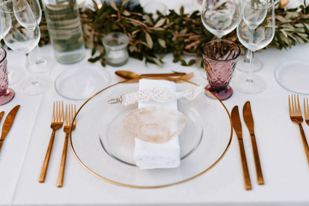 istock Beautiful Boho Wedding Table Decoration with a transparent shell on the plate 1287429510