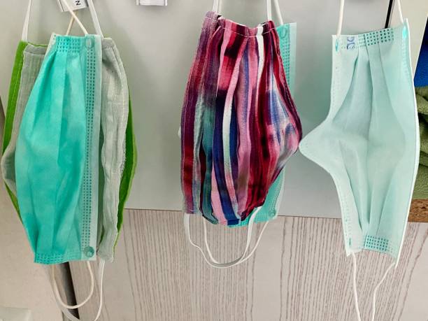 Facial protection masks hanging in line