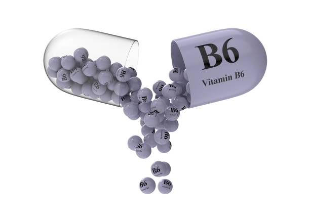 istock Open capsule with b6 from which the vitamin composition is pouring 1287432866
