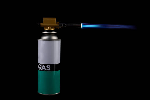 Flamethrower burner gas blow torch Ignition with blue fire flame at black background