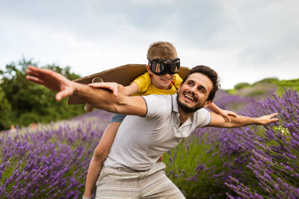 istock Father and son enjoying on lavender field 1287434049