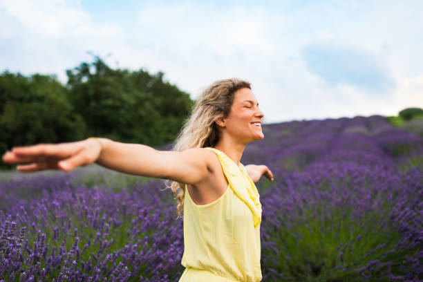 istock Woman enjoying on lavender field 1287434249