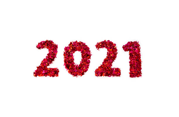 istock Figures 2021 made of red glitter on white background 1287434300
