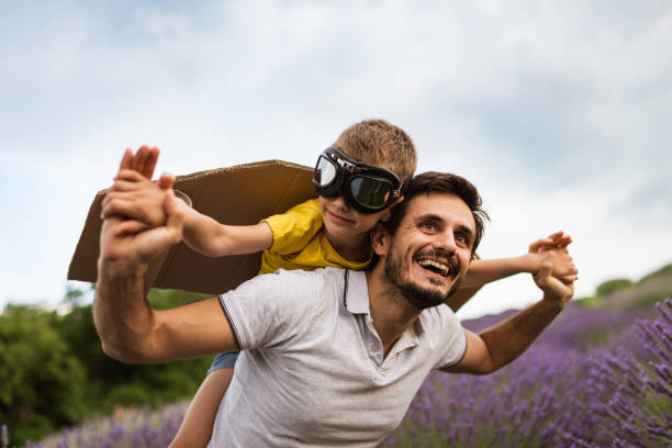 Father and son enjoying on lavender field