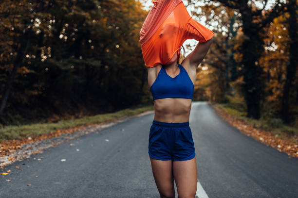 istock Sporty woman outdoors before run 1287435713