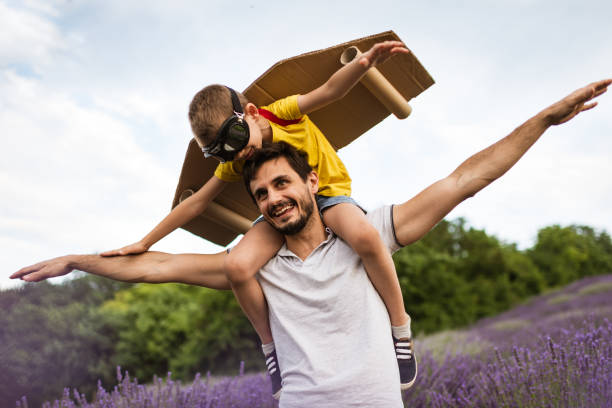 istock Father and son enjoying on lavender field 1287435828