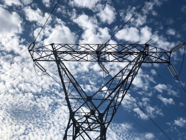 istock Pylon electricity poll with cloudy sky in background 1287435837