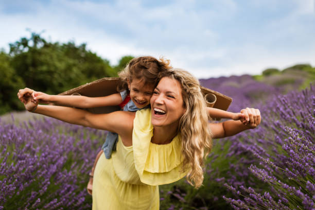 istock Mother and daughter enjoying on lavender field 1287435892