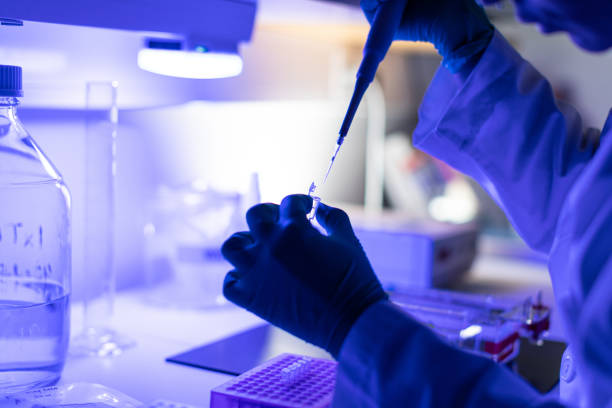 istock Researcher at work in DNA laboratory: coronavirus test for Covid 1287436740