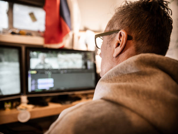 istock Male video editor working at home 1287436786