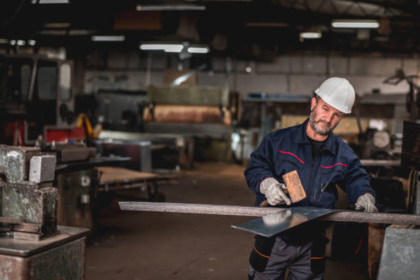 istock Mature man in factory workshop working alone 1287436903
