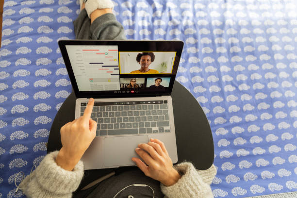 istock Woman in video conference on the bed 1287437197