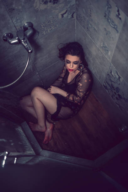 istock Stressed Female Crying In The Shower 1287438236