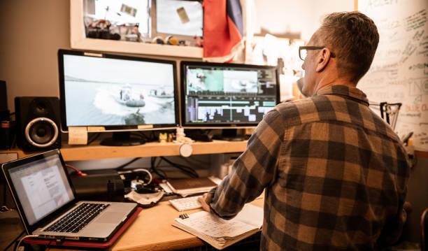 istock Male video editor working at home 1287438276