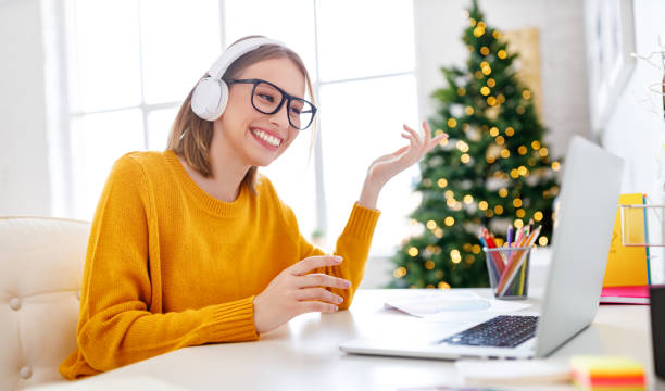 istock Happy employee making video call on Christmas day 1287438329