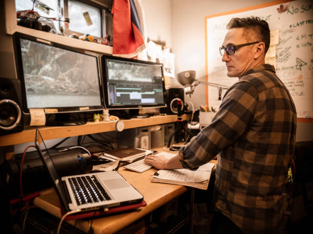 istock Male video editor working at home 1287438481