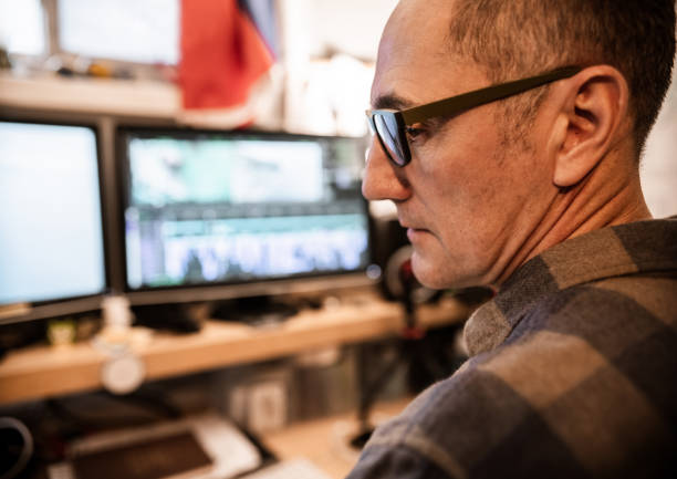 istock Male video editor working at home 1287438937