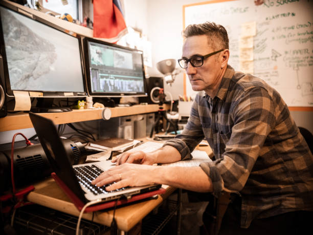 istock Male video editor working at home 1287439010