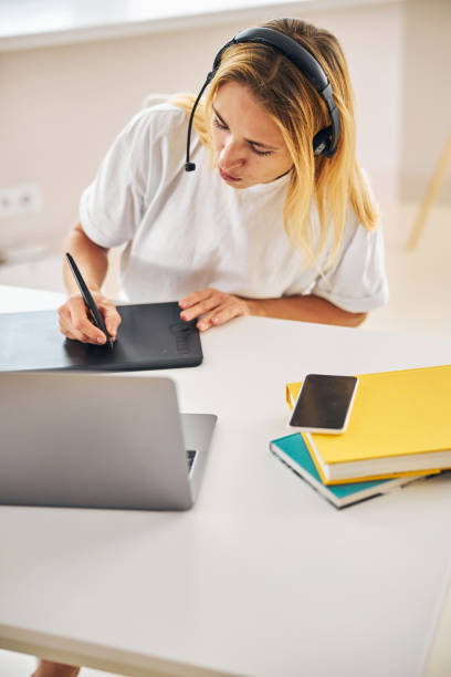 istock Caucasian female artist involved in creative process 1287439249