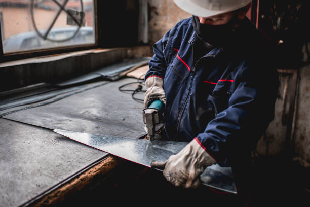 istock Mature man in factory workshop working alone during epidemic 1287439252
